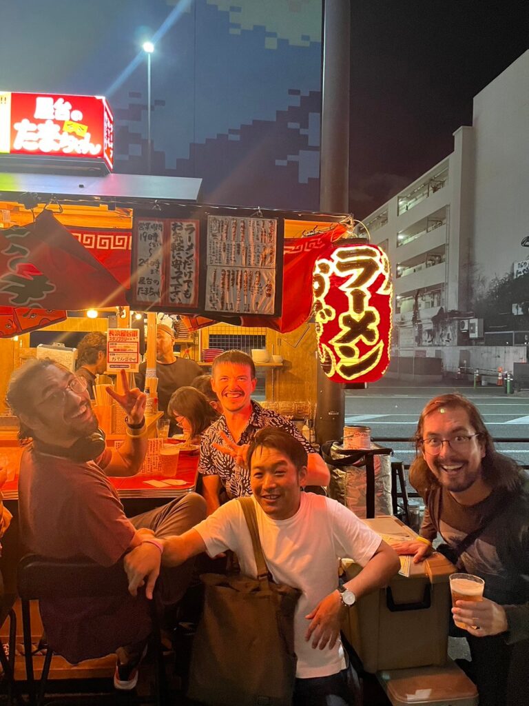 Happy people at a street food stall in Fukuoka, Japan